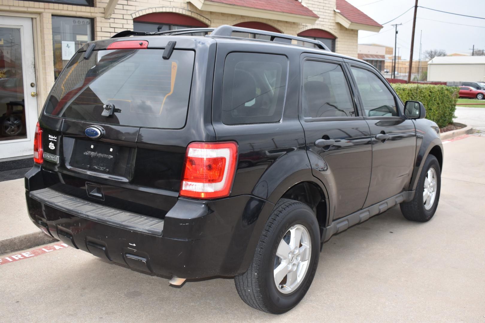2010 Black /Gray Ford Escape (1FMCU0C78AK) with an 4.25L engine, 6-Speed Automatic transmission, located at 5925 E. BELKNAP ST., HALTOM CITY, TX, 76117, (817) 834-4222, 32.803799, -97.259003 - Buying a 2010 Ford Escape can offer several benefits, including: Affordability: Since it's an older model, you can typically find a 2010 Ford Escape at a lower price compared to newer SUVs. This can be advantageous if you're on a budget or looking for a reliable vehicle without breaking the bank. - Photo#5
